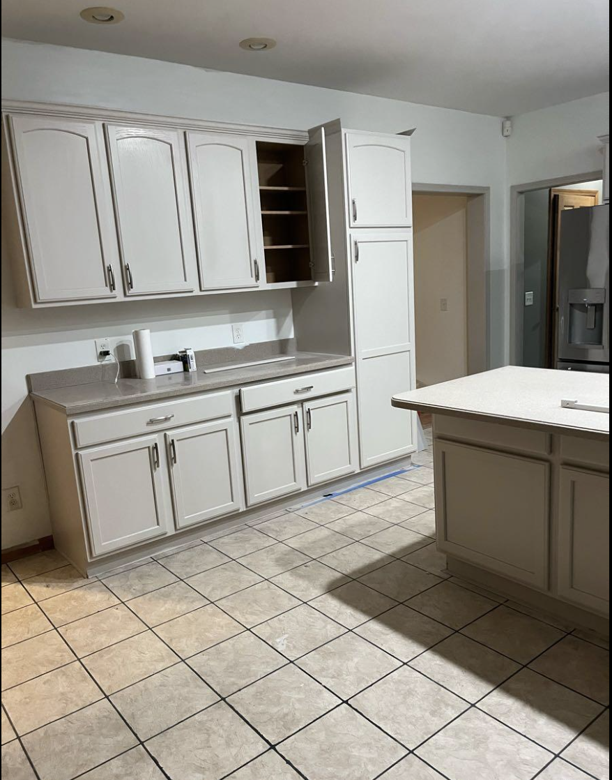 Kitchen with cabinets being refurbished